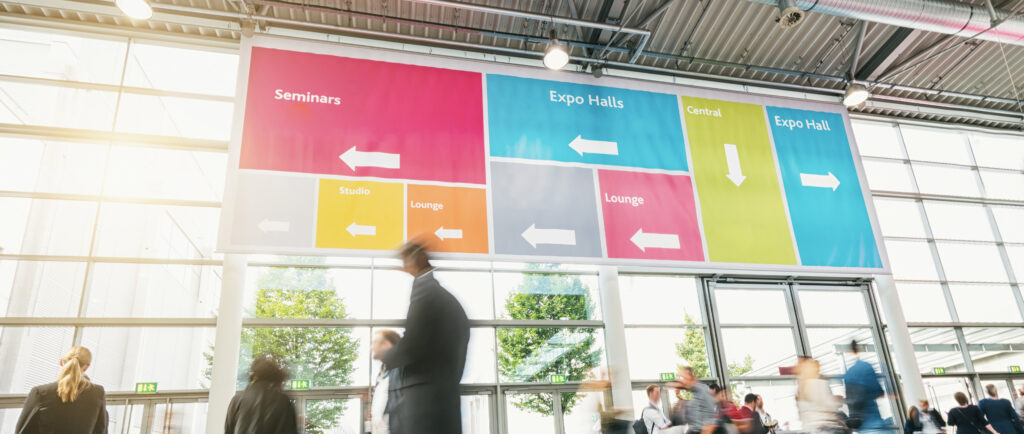 Tradeshow,Visitors,Rushing,In,A,Modern,Hall